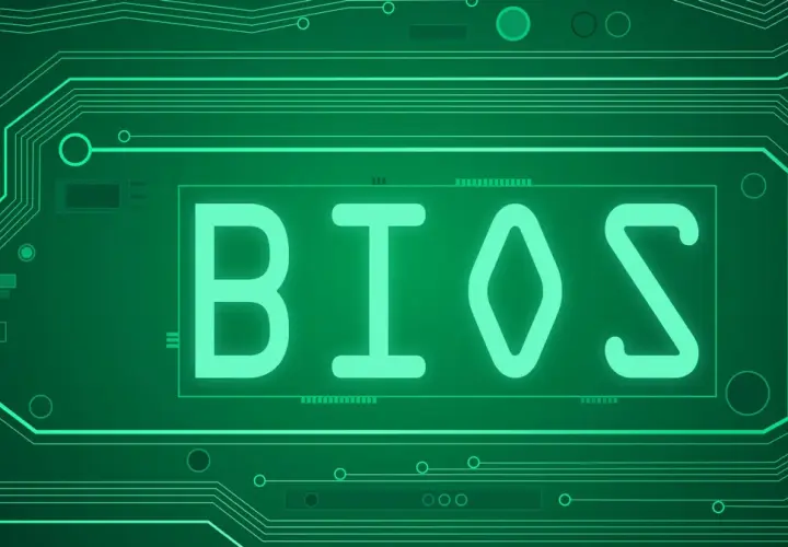 Zielony obwód drukowany z napisem BIOS. Dowiedz się, jak zaktualizować BIOS, aby Twój komputer działał sprawniej.