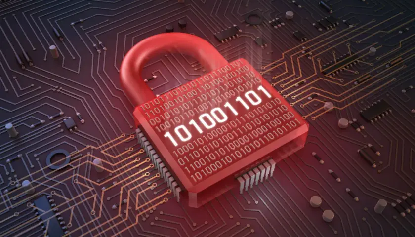 Czerwona kłódka z kodem binarnym na tle obwodów drukowanych. Symbolizuje bezpieczeństwo cyfrowe i ochronę danych, czyli to, czym jest firewall.