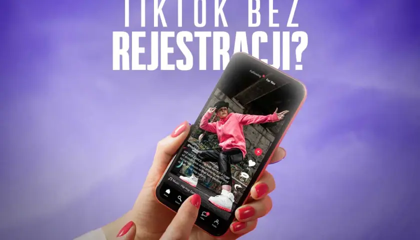 Dłoń trzyma smartfon z otwartym TikTokiem, pokazującym taniec hip-hop. Możliwy **tiktok za darmo bez instalowania**?