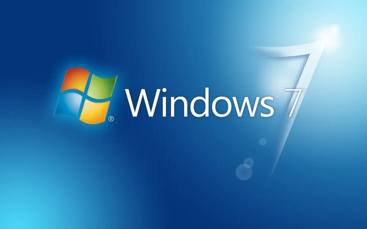 Logo Windows 7 na niebieskim tle. Klasyczny wygląd systemu, który wielu wspomina z sentymentem.
